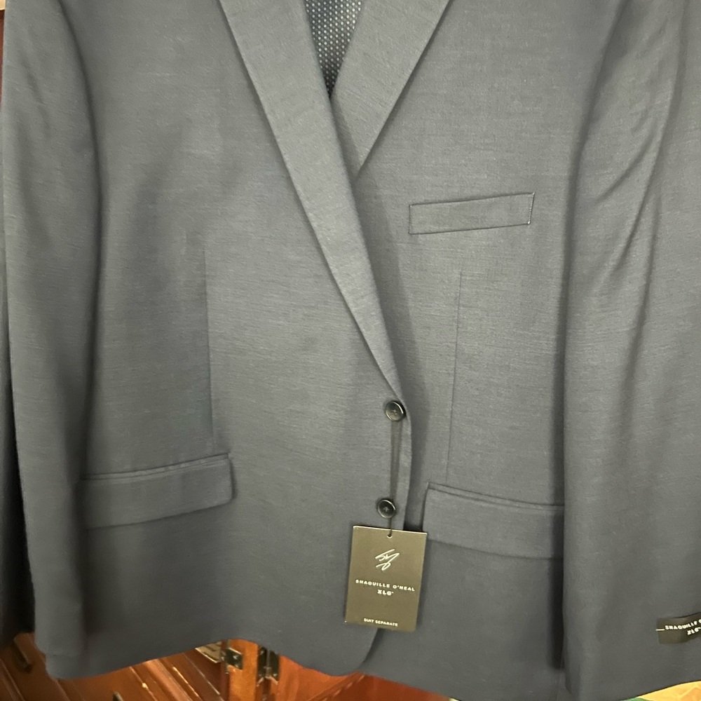New two piece mens suit. Never worn, smoke free home.
